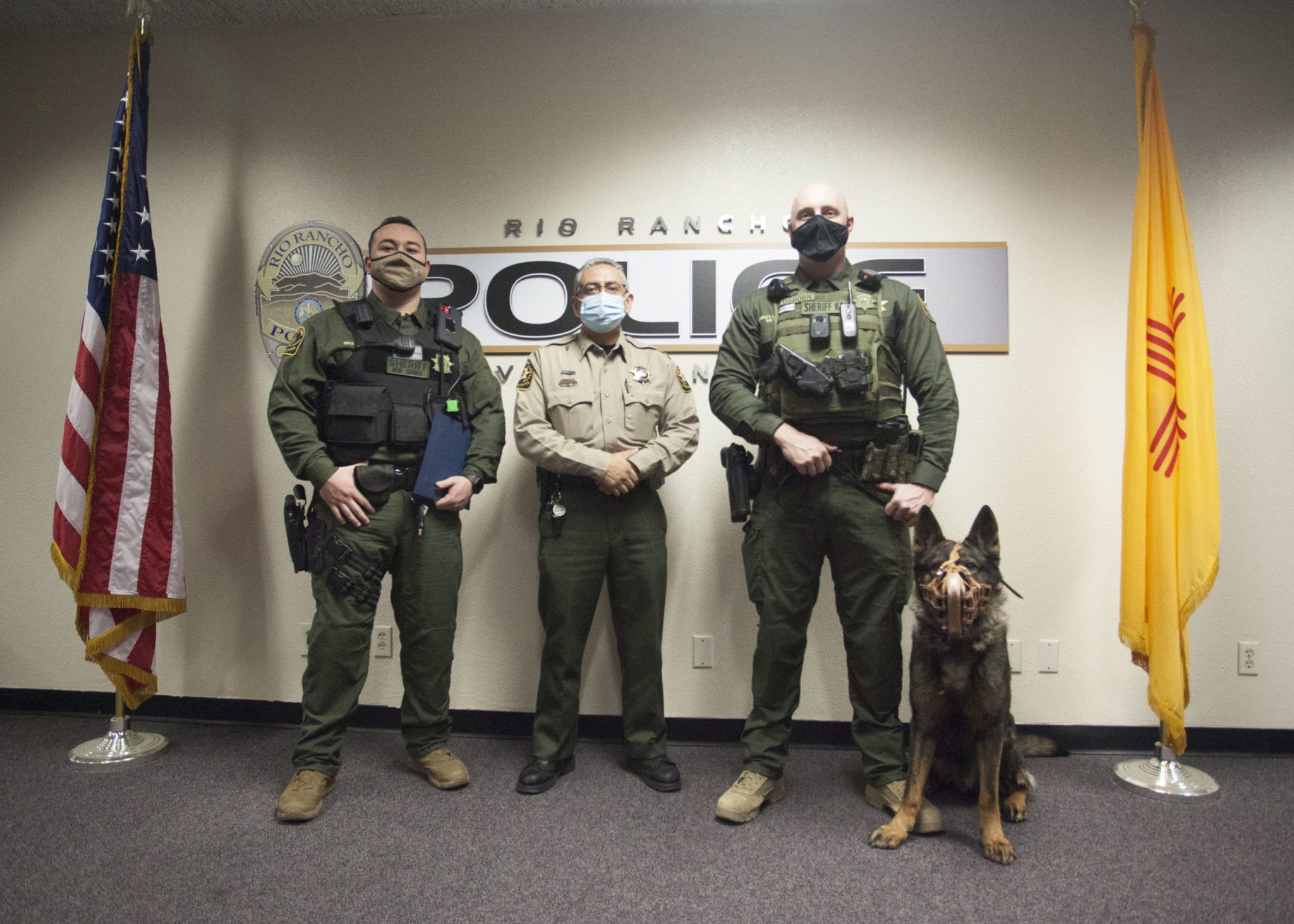 Two Sandoval County Sheriff's Deputies receive an award for their
