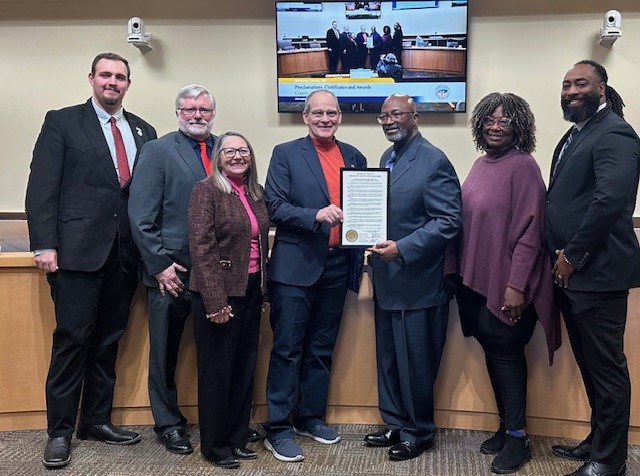 From left to right: Vice Chair Jordan Juarez, District 4, Commissioner Jon Herr, District 2, Commissioner Katherine A. Bruch, District 1, Rio Rancho NAACP Branch 6108 Amina N. Everett, MBA, Treasurer, and Commissioner Joshua Jones, District 5