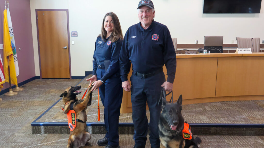 Fire & Rescue Captain Shannon Farrell and K9 Mini and Fire & Rescue Handler David Farrell, 
and K9 Shamus