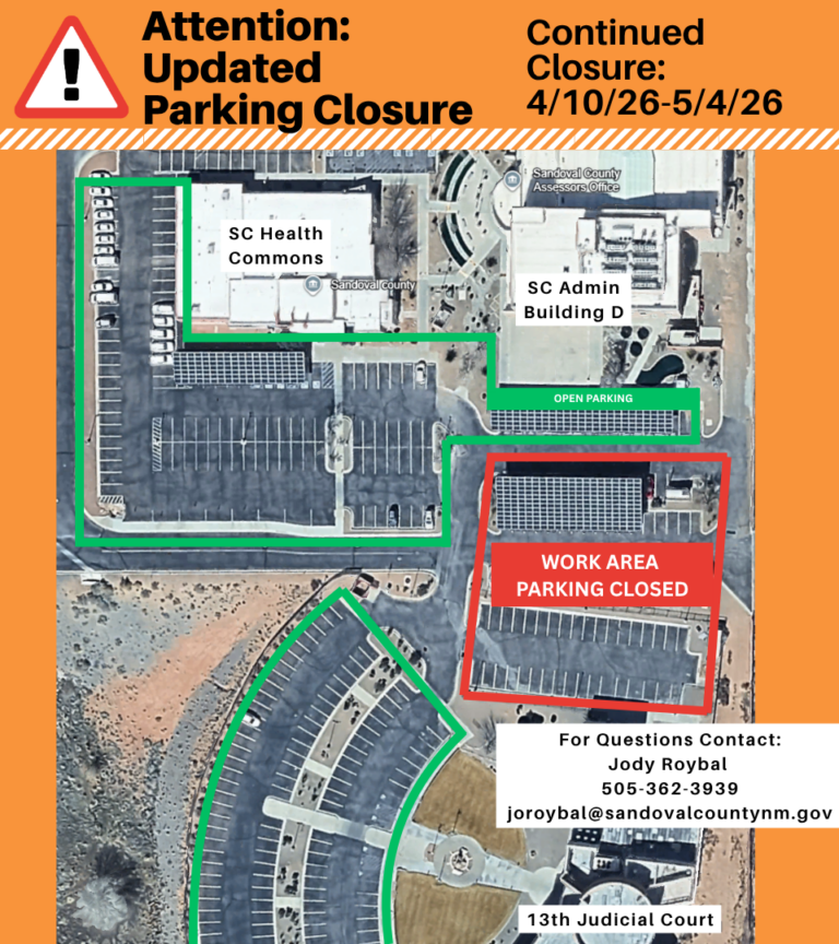 Flyer with aerial view of Sandoval County buildings with extensive parking lots and solar panel arrays. The Sandoval County Assessor's Office and District Court are labeled. Red lines are around an area of parking that is closed off. TEXT: Attention Updated Parking Closure. Continued Closure: 4/10/26-5/4/26. For questions contact: Jody Roybal 505-362-3939 joroybal@sandovalcountynm.gov.