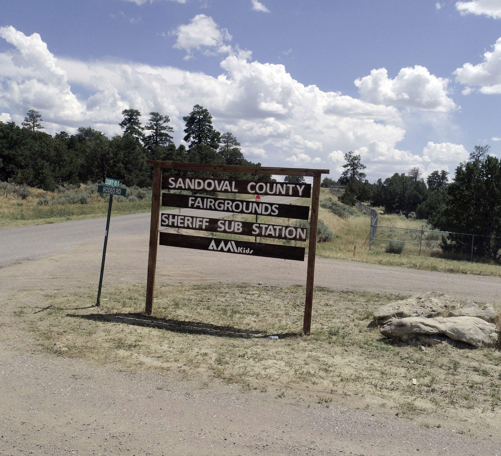 Wooden welcome sign to sandoval county fairgrounds and sheriff sub station
