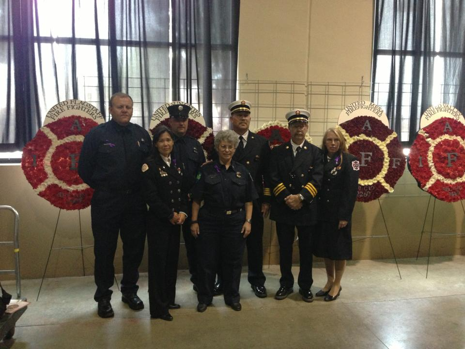 Firefighters at a memorial