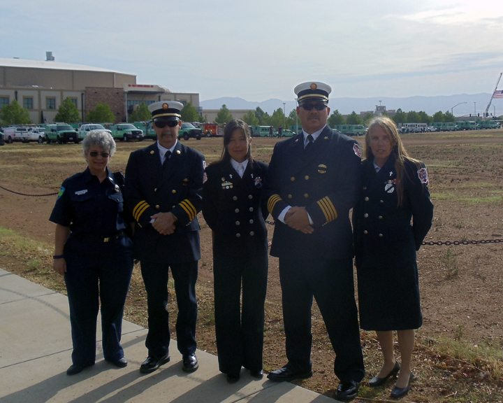 Firefighters outside at a memorial